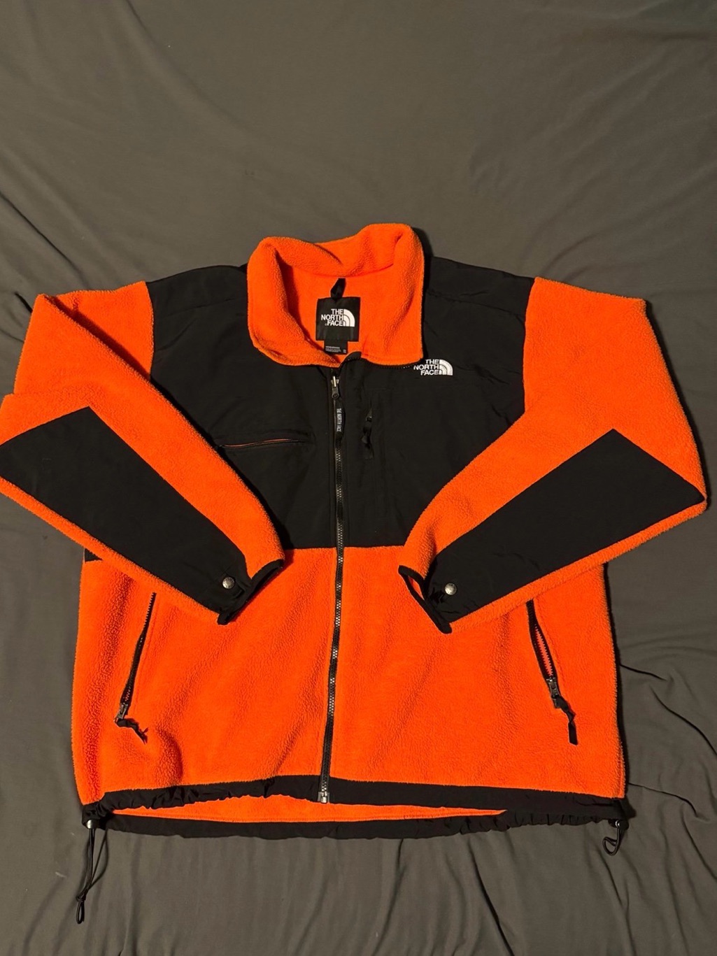 The North Face Men’s Orange And Black Sherpa Fleece Jacket